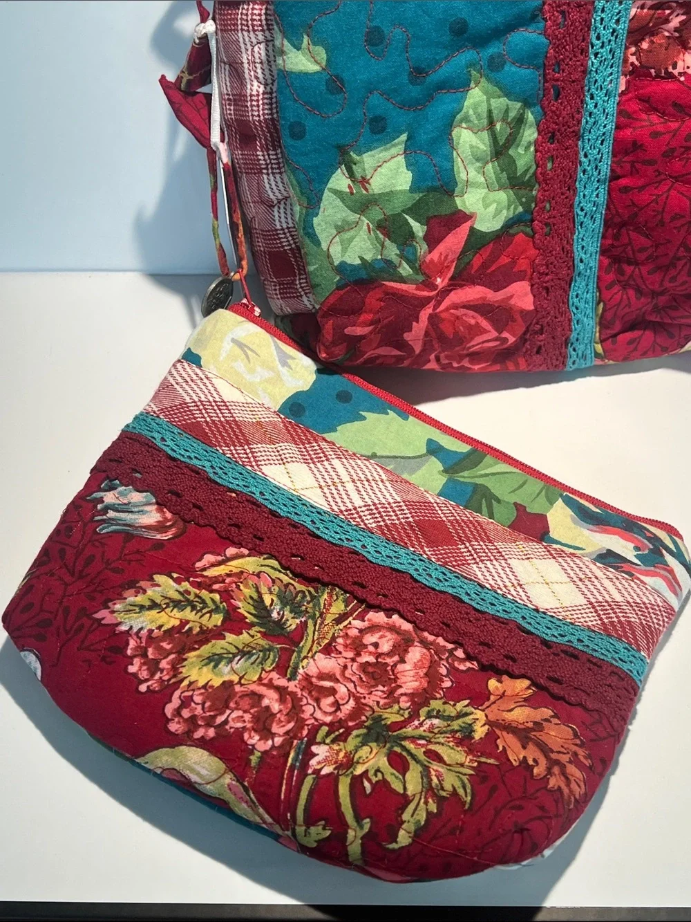 April Cornell Red Floral Quilted Cosmetic Crossbody with Teal Accents